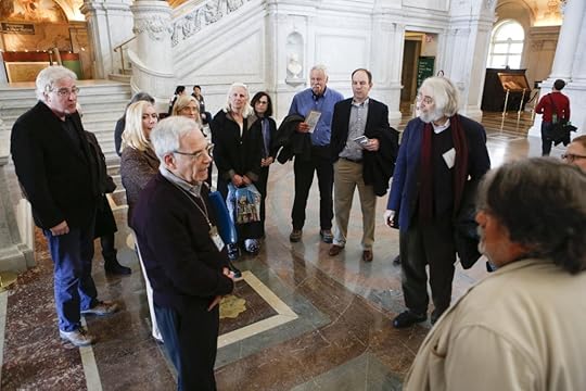 Docent Ira Adler (front left) escorts a group of Pulitzer Prize winners in the Great Hall last week. The recipients were in Washington for the kickoff event of a yearlong celebration marking the prize’s centennial. Photo by Shawn Miller.
