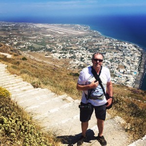 Fletch - climbing to the top of a mountain to see the ancient city of Thira
