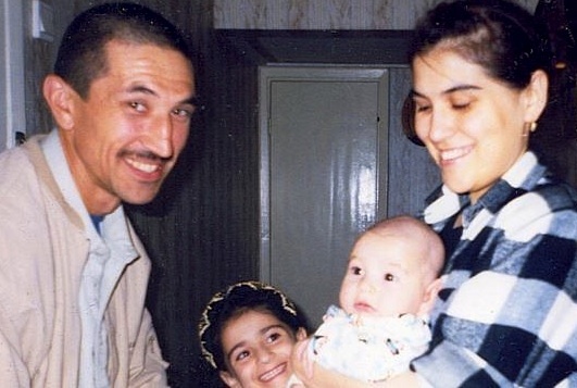 Guantanamo prisoner Ravil Mingazov, who us one of 36 men eligible for Periodic Review Boards, but who have not yet been given a date when their reviews will take place. This photo is of Ravil with his family, in a photo taken before his capture.