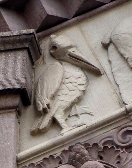 Another pelican at 215 Columbia. Can also see a duck on the frieze.