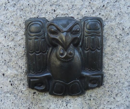 Small metal adornment First between Spring and Seneca