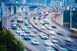 curved ramp bridge with busy traffic vehicles motion blur
