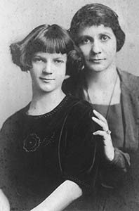 Photo of a mother and daughter, with clothes displaying their sewing skills