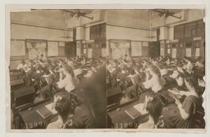 Photograph of 1908 geography class with students using stereoscopes.