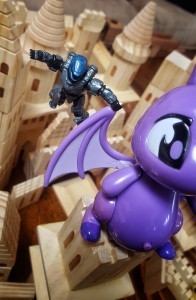 Hero Guy holds on for dear life as Dragon tries to flee.