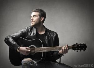 guitarist-playing-an-acoustic-guitar