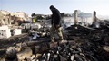 REUTERS/Mohamed al-Sayaghi - A Houthi militant walks through smoke and debris at an amusement park after it was hit by Saudi-led air strikes in Yemen's capital Sanaa, February 12, 2016.