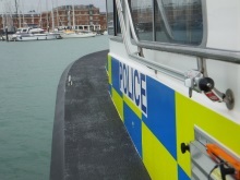 Heading across to Royal Clarence Marina on the police launch