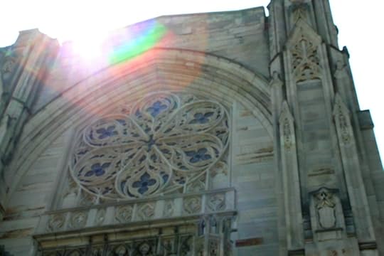 An upward angled-shot of First Presbyterian, a gothic cathedral with a rose window.