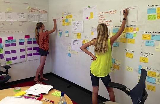 People working on a UX wall