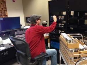 Audio engineer Brian Hoffa loads cassettes for parallel digitization. Photo by Gene DeAnna. 