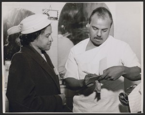Rosa Parks collecting NAACP membership dues of $2.00, likely during her trip to Los Angeles, California, in 1956. Photograph by McLain's Photo Service.