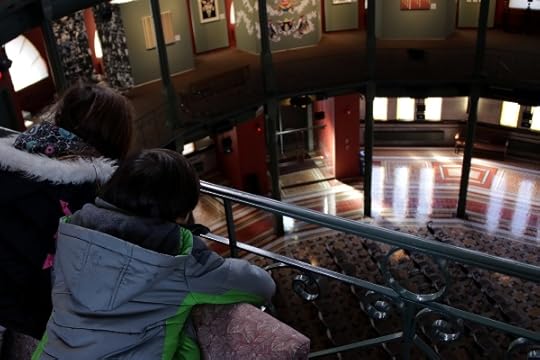 SteelyKid and The Pip looking down from the third floor railing inside the Nott Memorial,