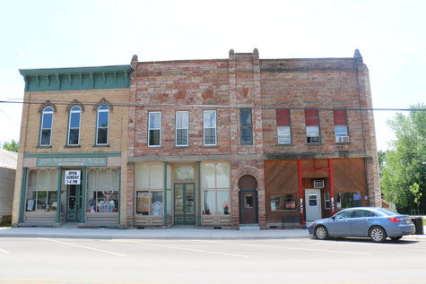 A photo of three historic buildings in Lyons, Michigan.