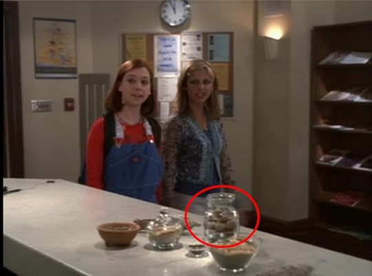 Buffy and Willow are walking into the library, and on the counter there are various little bowls and jars of herbs. One of them looks like a glass stash jar full of nugs.