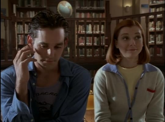 Xander, trying to make it look like his hand raising is just him trying to scratch his face, and Willow, not raising her hand and staring dreamily at Giles.