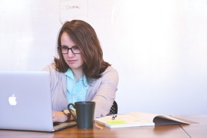 white woman in front of laptop