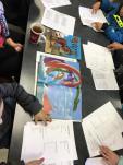 Kids pouring over medieval picture books and writing stories
