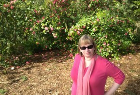 me posing next to camellias in bloom