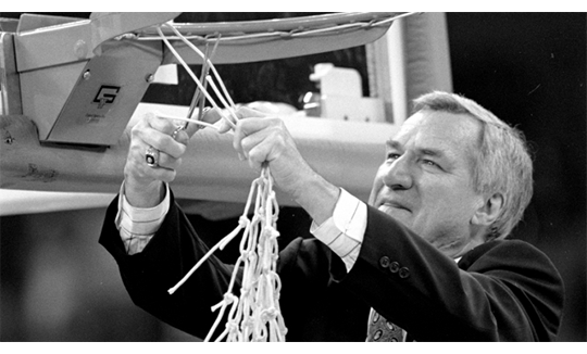 Dean Smith cutting the net