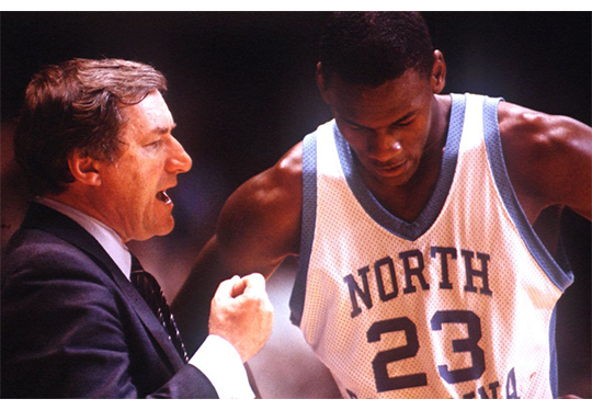 Dean Smith coaches Michael Jordan