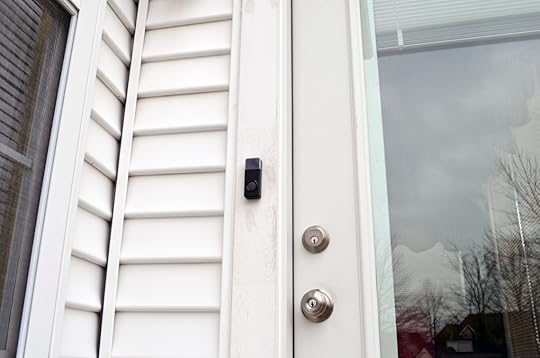 The doorbell. You can store paper notes in the area behind the transparent cover.