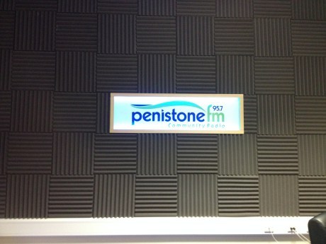 The logo of Penistone FM in situ, inside of the studio