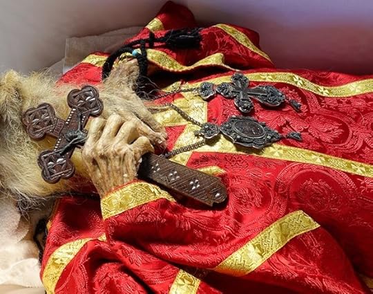 In new vestments, ready for reburial. Conditions inside the tomb tarnished the metal and eroded the enamel on his cross and pendant (compare to photo on first page) [Photo by Vladimir Grigorenko]
