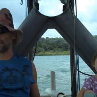 Jaimie and his daughter traveling between their islands.