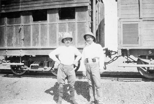Kitchener's intelligence officer, Colonel Sir Francis Wingate (left), in front of several trucks of the Sudan Military Railway