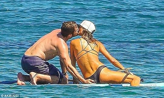 kiss on a paddleboard: