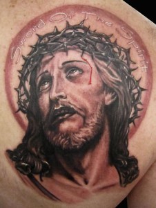 bleeding-jesus-head-tattoo-on-back-shoulder