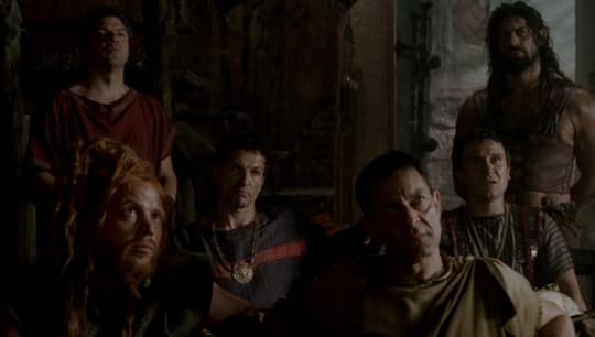 In this group of several scary looking dudes in togas and leather armor and stuff, one guy is wearing a black toga with a red stripe across the chest, giving him the appearance of a guy wearing a track suit. He also has a big gold medallion on his necklace, and he's real, real Italian.