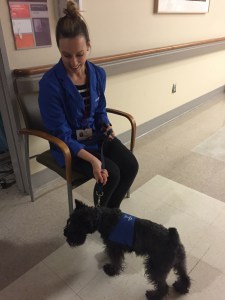 Kristin with Echo, a dog that visits patients