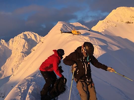 Skiers prepare for a steep Alaska descent in January 2016, Silverton's heli perched on the ridge. Photo: Christopher Steiner