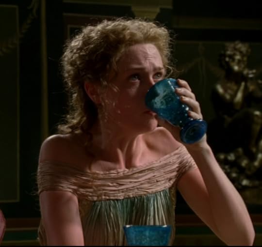 Octavia's dress is made out of some crinkly silk fabric, with wide off-the-shoulder straps in a cream color, while the rest of the dress is like, streakily-died blue green. She's also gulping down water, because she's high as goddamn.