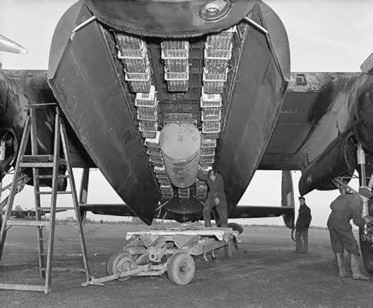 Bomb bay of an Avro Lancaster of No. 57 Squadron RAF at Scampton Lincolnshire. loaded with a 4,000 impact-fused HC bomb ('cookie'), and 12 Small Bomb Containers (SBCs) each loaded with incendiaries. (Imperial War Museum)