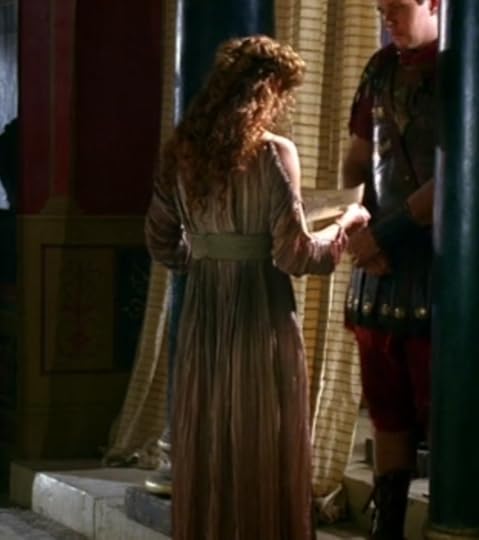 Octavia's dress, shown from the back, has like, open sleeves, and it's like, dip dyed or something, so the pink and the green and the yellow kind of blend all together in a gradient.