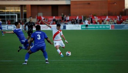 Rayo OKC's Sebastian Velasquez attempts a shot as FCE's Cristian Raudales and Eddie Edward move in. PHOTO: NASL