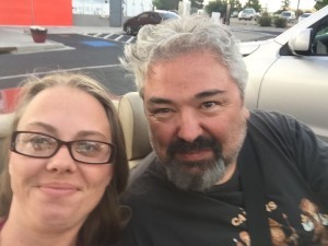 My lovely bride and I with the top down enjoying a day out together.