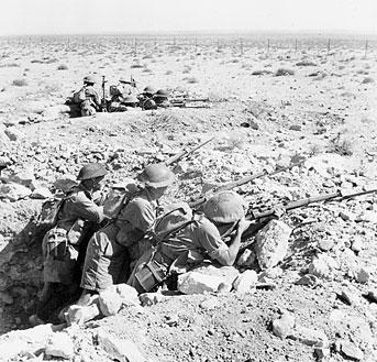 Australian troops in a foxhole near Tobruk, Libya, 1941 (Imperial War Museum)