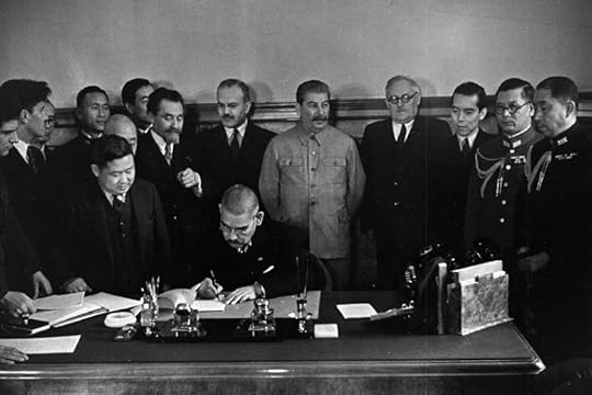 Japanese Foreign Minister Matsuoka signing the Soviet-Japanese Neutrality Pact, 13 Apr 1941, Molotov and Stalin in background (public domain)