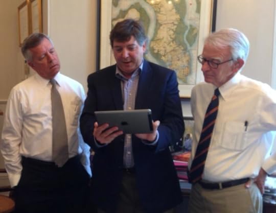 Rick Honeycutt shows off his new product to Joseph P. Riley, right, the mayor of Charleston, SC.
