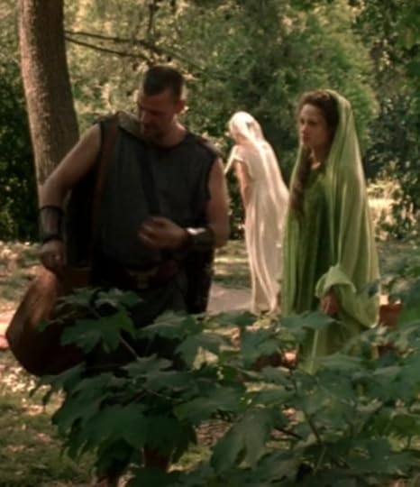 A bad screen cap of Pullo and Eirene standing in the little glad where they have their murder day picnic. Eirene's veil is very light green, her dress is darker green.