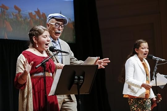 Juan Felipe Herrera with young poets Sarita Sol Gonzalez (left) and Elena Medina. Photo by Shawn Miller. 