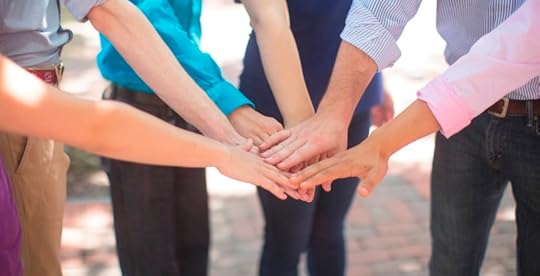 Team with hands in center