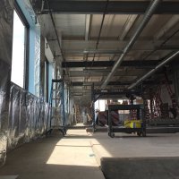 Insulation and vapor barrier going in on south wall. Photo by Will Holman