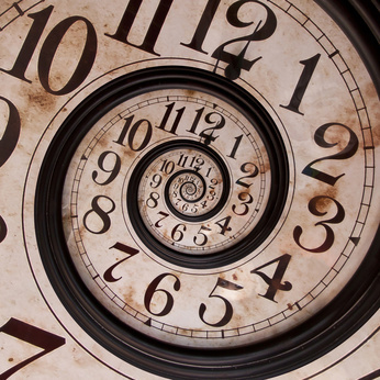 Spiraling image of a clock face with big bold numbers reducing in size 