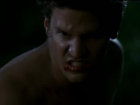 Angel, naked and snarling, with blood all over his mouth.
