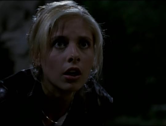 Buffy staring wide-eyed with shock.